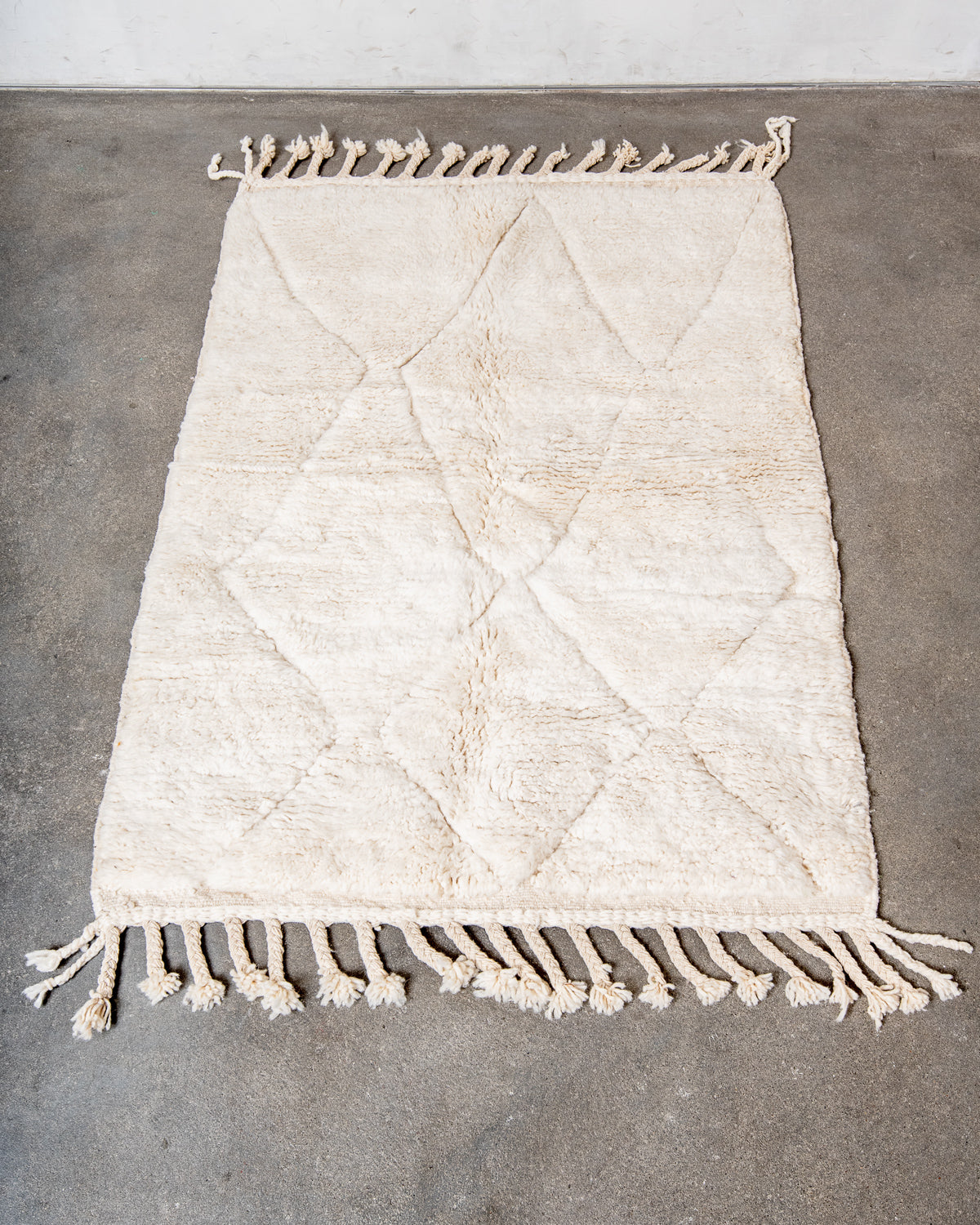 Modern, designer, handcrafted Berber rug from Morocco. Beniourain carpet with minimalist design, natural wool pile and a fluffy texture.
